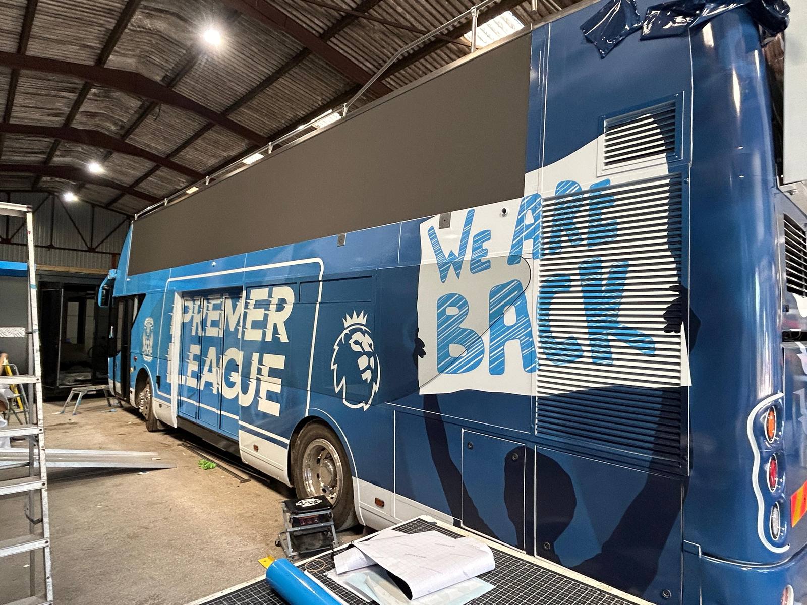 Premier League bus wrap in the workshop